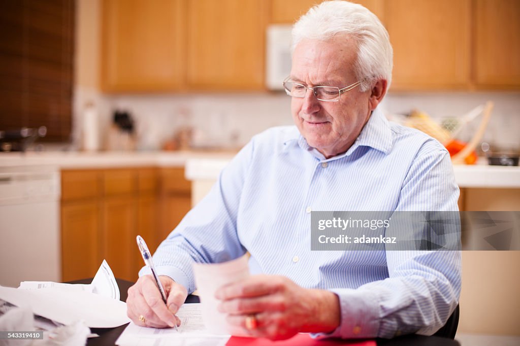 Senior Business Man Preparing Taxes