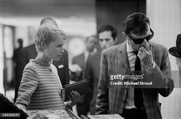 American actress Mia Farrow and Lithuanian-born actor Laurence Harvey at London Airport, 1967.