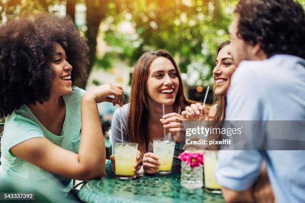 group of friends having iced drinks in cafe - summer refreshment stock pictures, royalty-free photos & images