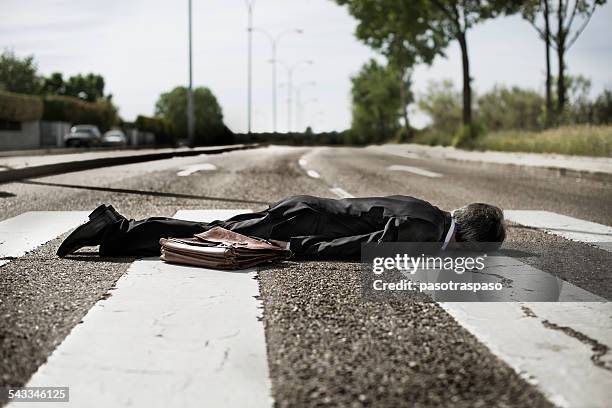 businessman lying on zebra crossing. - of dead people in car accidents ストックフォトと画像