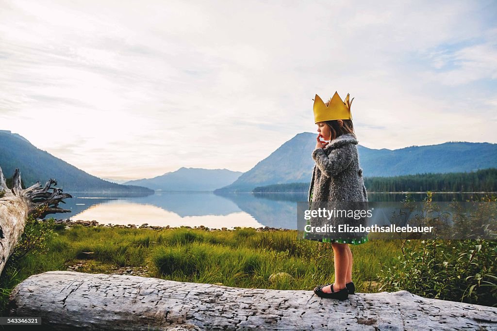 Girl (2-3) wearing crown outdoors