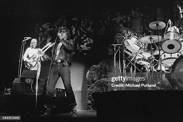 Mike Rutherford and Peter Gabriel performing with English progressive rock group Genesis at the Empire Pool, London, 14th-15th April 1975.