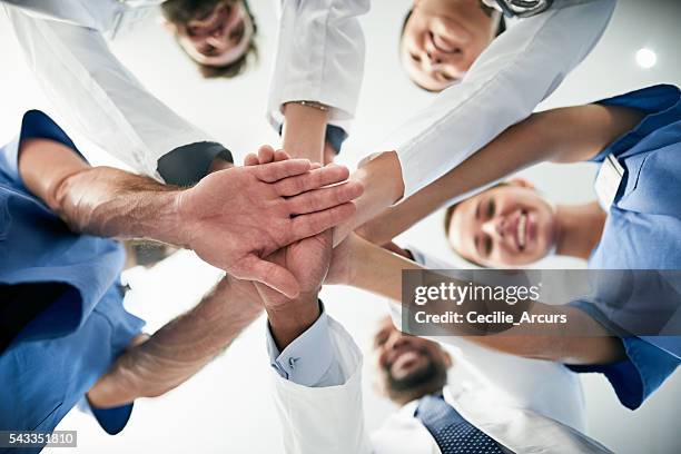 your health in our hands - hands at work stockfoto's en -beelden