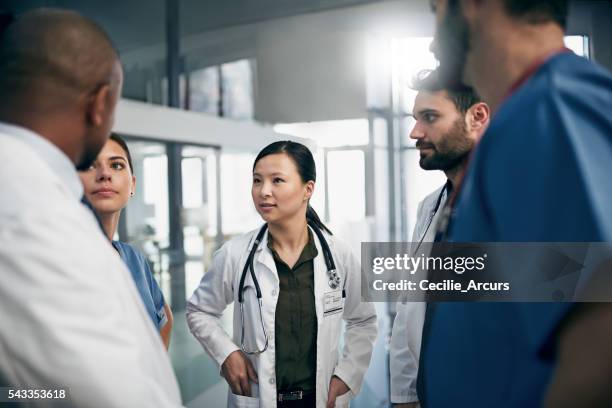 synchronizing their tasks before shift - hospital teamwork stock pictures, royalty-free photos & images