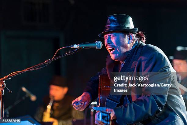 American musician Lena Naipo plays guitar as he leads his 1930s Hawaiian-style big band Kahulanui during the 12th Annual GlobalFest at Webster Hall's...