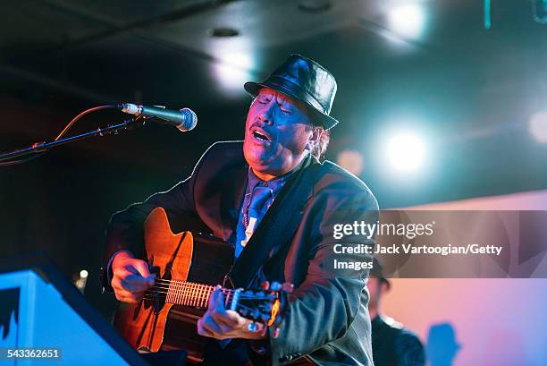 American musician Lena Naipo plays guitar as he leads his 1930s Hawaiian-style big band Kahulanui during the 12th Annual GlobalFest at Webster Hall's...