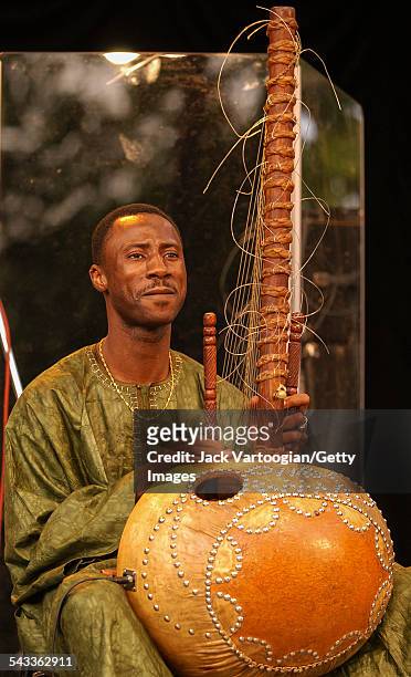 Malian musician Yacouba Sissoko plays kora during a performance with Ramatou Diakite's band at Central Park SummerStage, New York, New York, July 2,...