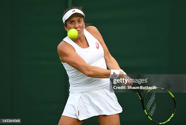 Irina Falconi of the United States plays a backhand shot during the Ladies Singles first round match against Marina Erakovic of New Zealand on day...