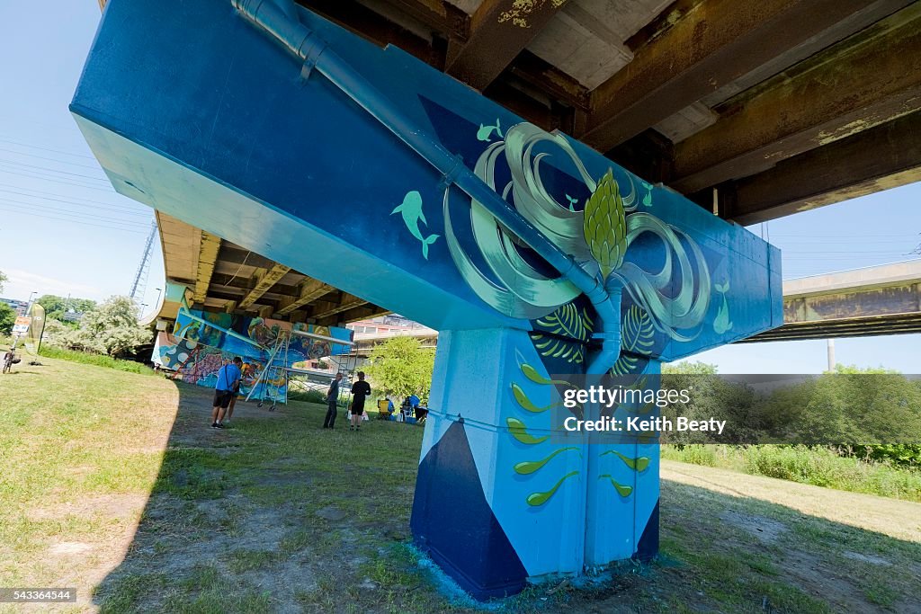 Eight artists are creating "a love letter to the Don River," by creating permanent murals on the underpass of the DVP to Gardiner ramps.