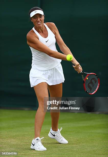 Samantha Crawford of the United States plays a backhand shot during the Ladies Singles first round against Paula Kanis of Poland on day one of the...