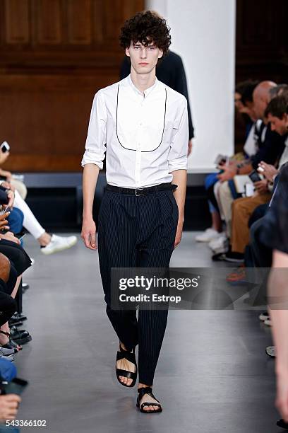 Model walks the runway during the Officine Generale Menswear Spring/Summer 2017 show designed by Pierre Mahéo as part of Paris Fashion Week on June...