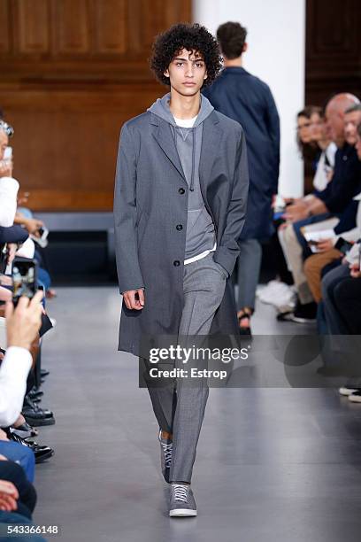 Model walks the runway during the Officine Generale Menswear Spring/Summer 2017 show designed by Pierre Mahéo as part of Paris Fashion Week on June...