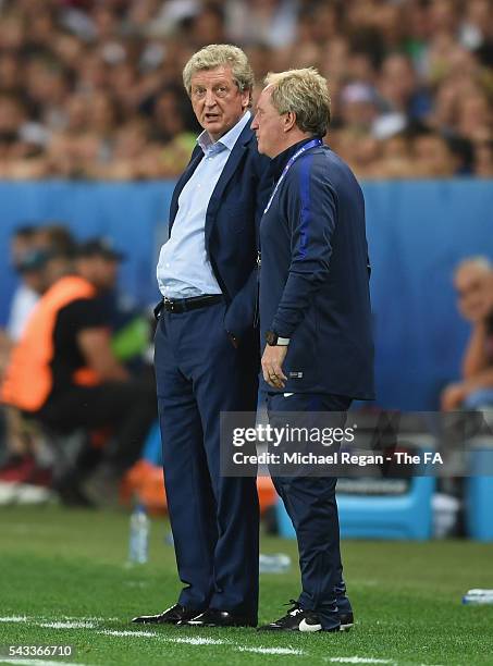 Roy Hodgson manager of England talks to assitant manager Ray Lewington during the UEFA EURO 2016 round of 16 match between England and Iceland at...