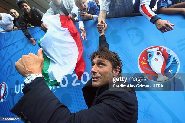 Head coach Antonio Conte of Italy celebrates with fans after the UEFA EURO 2016 round of 16 match between Italy and Spain at Stade de France on June...