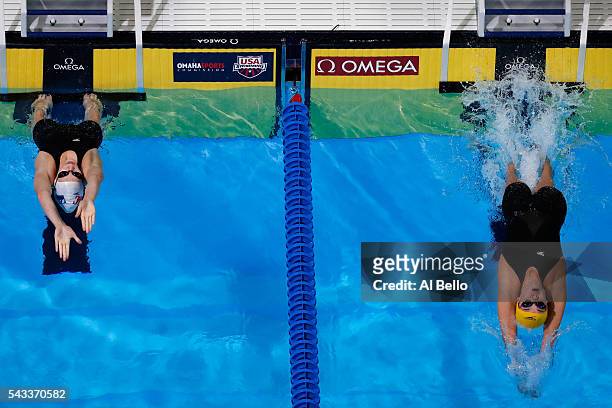 Alex Walsh and Rachel Bootsma of the United States compete in a heat for the Women's 100 Meter Backstroke during Day Two of the 2016 U.S. Olympic...