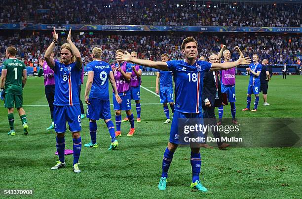 Elmar Bjarnason and Iceland players celebrate after the UEFA EURO 2016 round of 16 match between England and Iceland at Allianz Riviera Stadium on...