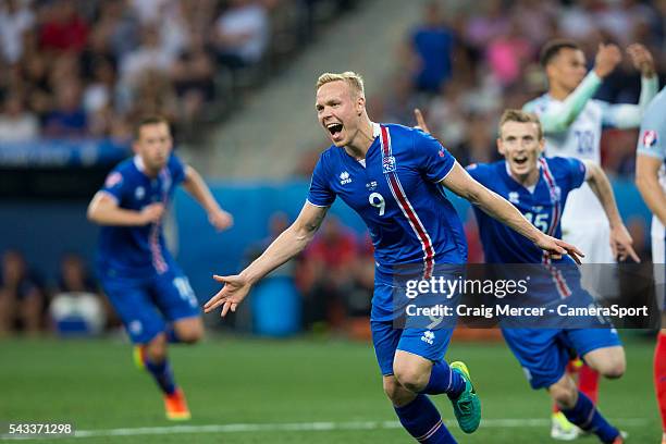 Iceland's Kolbeinn Sigthorsson celebrates scoring his sides second goal during the UEFA Euro 2016 Round of 16 match between England and Iceland at...