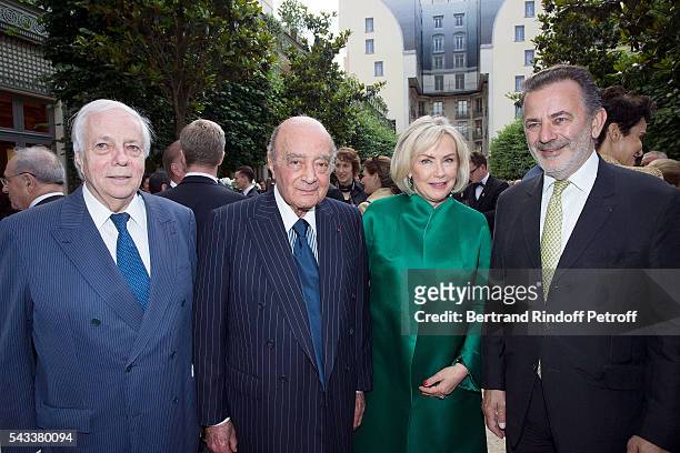 Franck Klein, Mohamed Al-Fayed and his wife Heini Wathen and Mayor of 1rd District Jean-Francois Legaret attend the "Colonne Vendome" Is Unveiled...