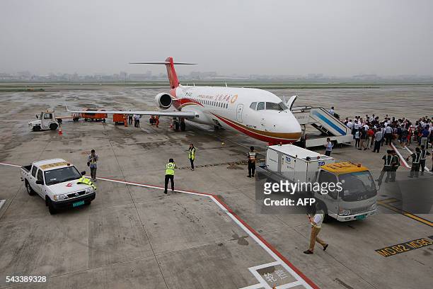 An ARJ21-700, China's first domestically produced regional jet, arrives at Shanghai Hongqiao Airport after making its first fight from Chengdu to...