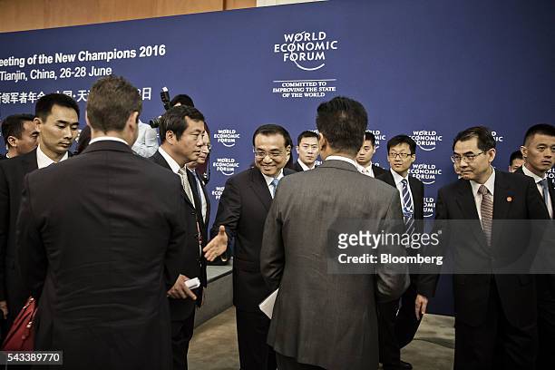 Li Keqiang, China's premier, greets participants after a meeting with business leaders at the World Economic Forum Annual Meeting of the New...