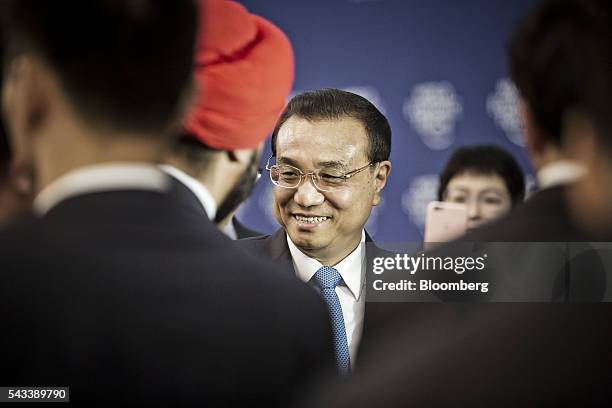 Li Keqiang, China's premier, greets participants after a meeting with business leaders at the World Economic Forum Annual Meeting of the New...