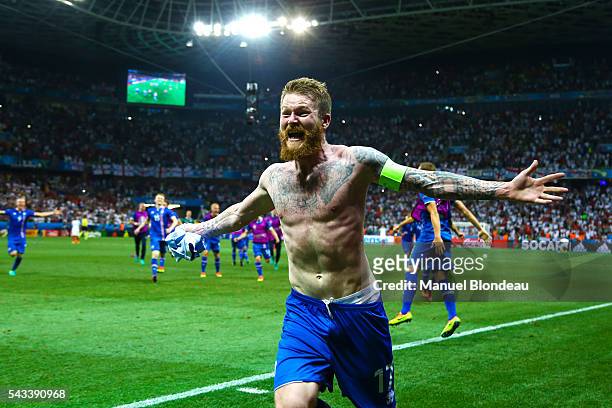 Aron Gunnarsson of Iceland celebrates at the end of the match during the European Championship match Round of 16 between England and Iceland at...