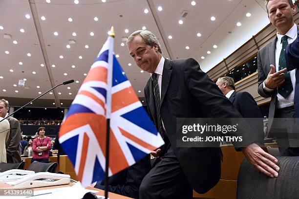 United Kingdom Independence Party leader Nigel Farage sits as he arrives at the European Union headquarters in Brussels on June 28, 2016 ahead of a...