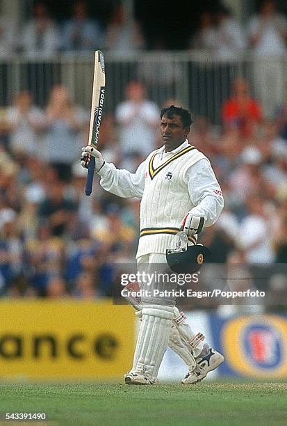 Aravinda de Silva raises his bat as he reaches his century during his innings of 152 in the only Test match between England and Sri Lanka at The...