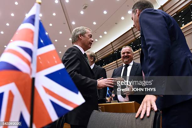 United Kingdom Independence Party leader Nigel Farage speaks as he arrives at European Union headquarters in Brussels on June 28, 2016 for a meeting...