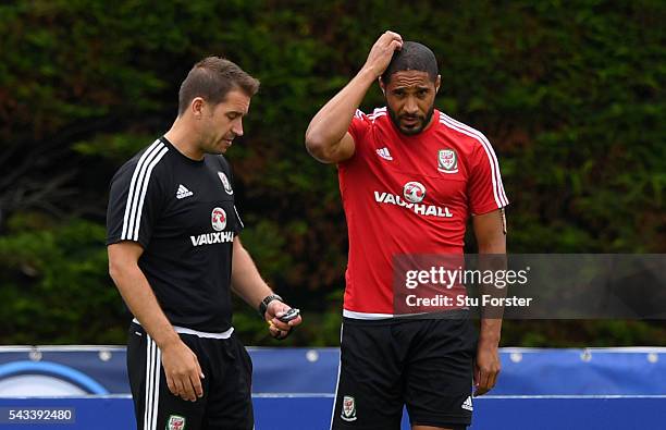 Wales captain Ashley Williams chats with Dr Adam Owen during Wales training at their Euro 2016 base camp ahead of their Quarter Final match against...