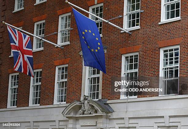 Union flag , and a European Union flag fly above Europe House, the head office of the UK Representation of the European Commission, and the UK...