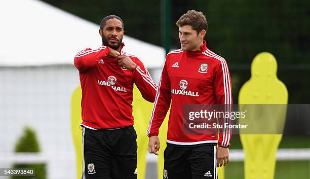 Wales captain Ashley Williams chats with Ben Davies during Wales training at their Euro 2016 base camp ahead of their Quarter Final match against...