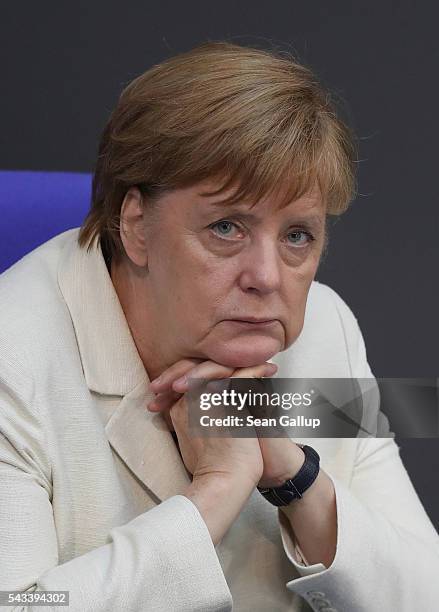 German Chancellor Angela Merkel listens to debates after she addressed the Bundestag with a government declaration on the recent Brexit vote on June...