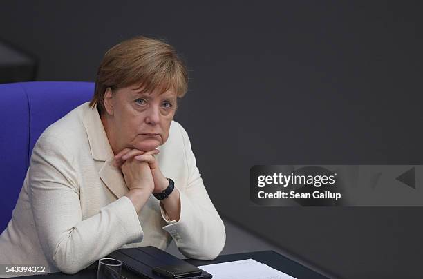 German Chancellor Angela Merkel listens to debates after she addressed the Bundestag with a government declaration on the recent Brexit vote on June...