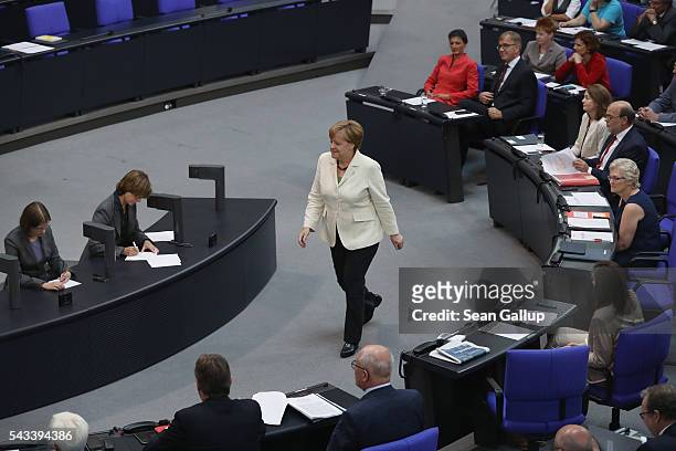 German Chancellor Angela Merkel chats with paliamentarians after she addressed the Bundestag with a government declaration on the recent Brexit vote...