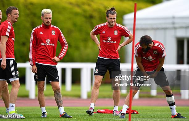 Wales player Gareth Bale shares a joke with Joe Ledley as Andy King and Aaron Ramsey look on during Wales training at their Euro 2016 base camp ahead...
