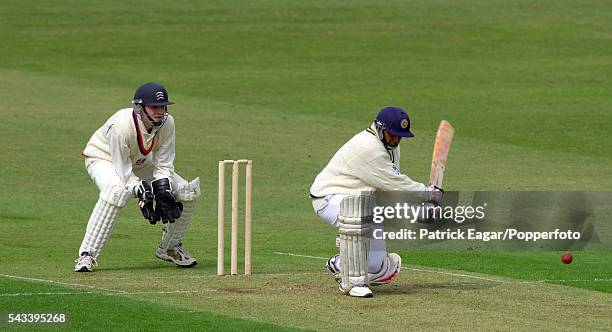 Aravinda de Silva of Sri Lanka reverse sweeps during the tour match between British Universities and the Sri Lankans at Northampton, 2nd May 2002....