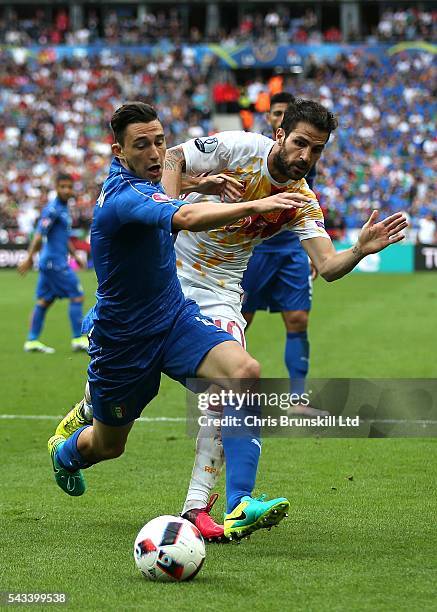 Matteo Darmian of Italy in action with Cesc Fabregas of Spain during the UEFA Euro 2016 Round of 16 match between Italy and Spain at Stade de France...