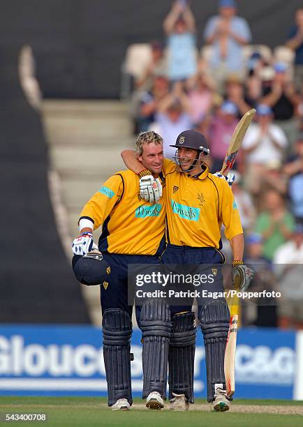 Sean Ervine of Hampshire is congratulated on reaching his century by Nic Pothas of Hampshire during the Cheltenham & Gloucester Trophy Semi Final...