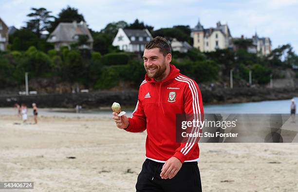 Wales striker Sam Vokes enjoys an Ice Cream and a stroll on Dinard beach on June 28, 2016 in Dinard, France.