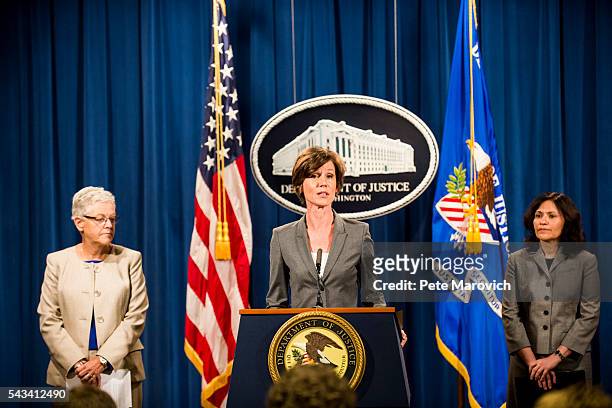 Flanked by Environmental Protection Agency Administrator Gina McCarthy and Federal Trade Commission Chairwoman Edith Ramirez , Deputy Attorney...