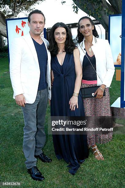 President of Fred, Rachel Marouani standing between Karine Silla and Vincent Perez attend Fred Jeweler Celebrates 80 Years of Creation at Hotel Cap...