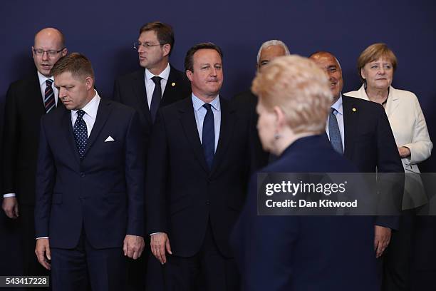 British Prime Minister David Cameron waits for the group family photo with the European Council during a European Council Meeting at the Council of...