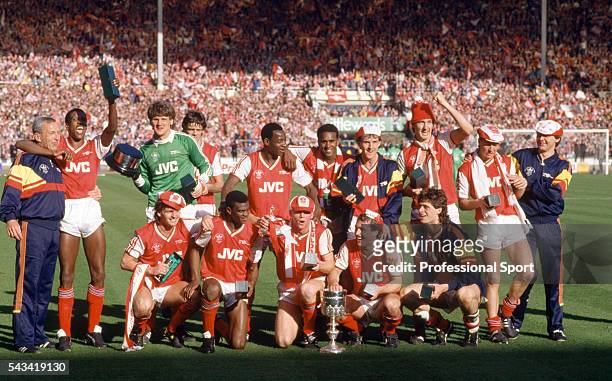 The Arsenal team celebrate with the trophy after the Littlewoods League Cup Final between Arsenal and Liverpool at Wembley Stadium in London, 5th...