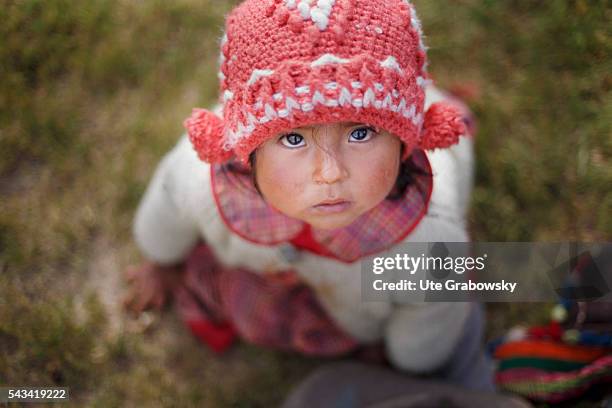 Tawarchapi, Bolivia Portrait of a little girl in the Andes of Bolivia on April 15, 2016 in Tawarchapi, Bolivia.