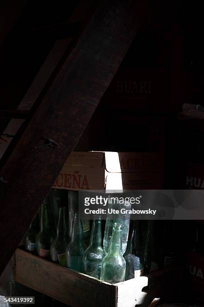Sacaca, Bolivia Dirty returnable bottles in a wooden box on April 14, 2016 in Sacaca, Bolivia.