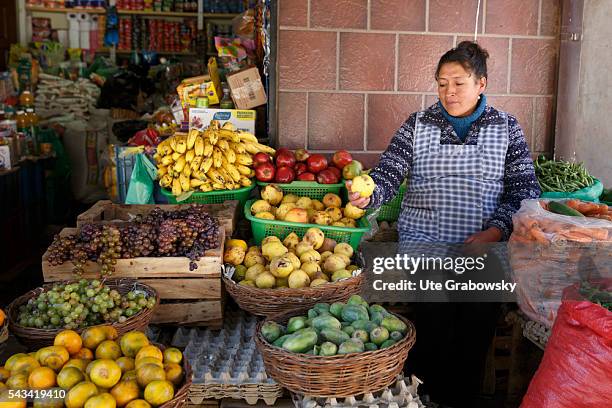 Sacaca, Bolivia Market woman at a fruit stand in Sacaca, a small town in the Andes of Bolivia on April 15, 2016 in Sacaca, Bolivia.