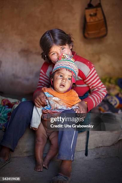 Tarwachapi, Bolivia Portrait of a girl and her brother in the Andes of Bolivia on April 16, 2016 in Tarwachapi, Bolivia.