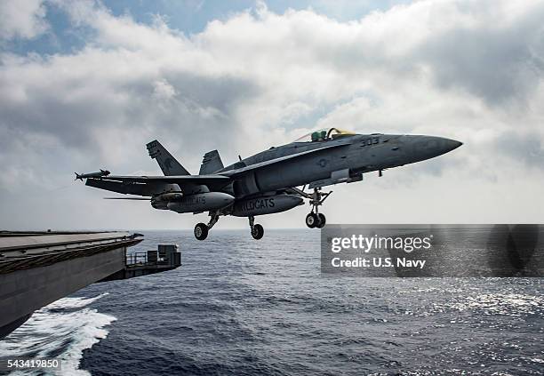 In this handout provided by the U.S. Navy, an F/A-18E Super Hornet assigned to the Wildcats of Strike Fighter Squadron 131 launches from the flight...