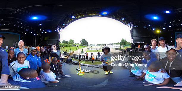 Prince Harry poses with Coldplay and the Sentebale Choir during the rehearsals for the Sentebale Concert at Kensington Palace on June 28, 2016 in...